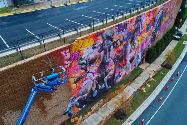 PichiAvo, Street Art Mural "Rivanna River by Poseidon", 5th Street Station, Charlottesville, Virginia 2017.  Photo Credit @skycladaerial