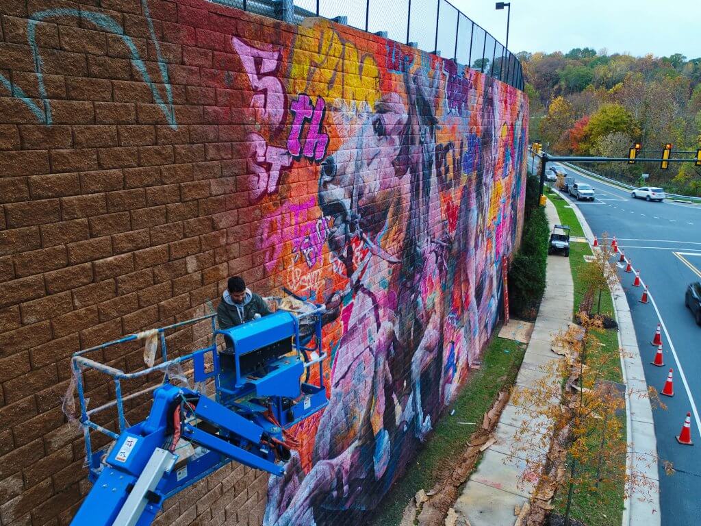 PichiAvo, Street Art Mural "Rivanna River by Poseidon", 5th Street Station, Charlottesville, Virginia 2017. Photo Credit @skycladaerial