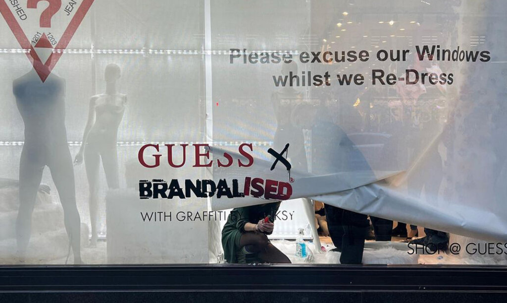 Banksy Accuses GUESS of Stealing his Artwork Designs and Encourages All Shoplifters to go Steal from the Clothes Range, London 2022. Image © Banksy