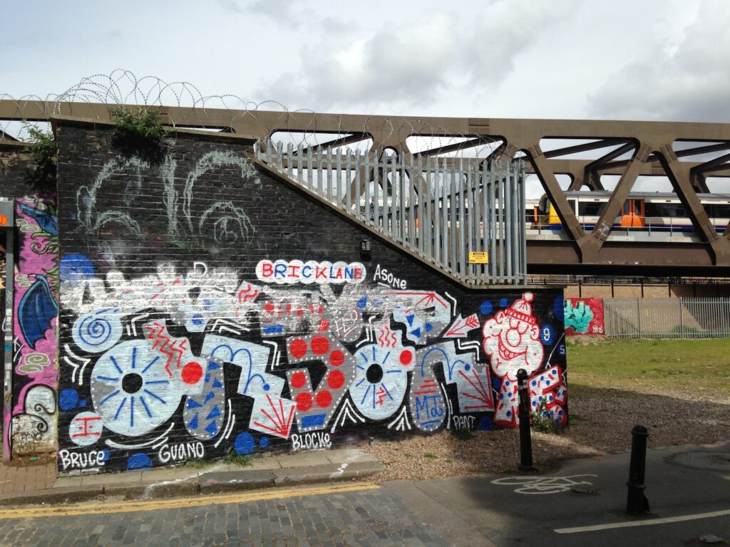 Brick Lane graffiti artwork on brick wall, Shoreditch, East London, 2013–2014, photographed by GraffitiStreet