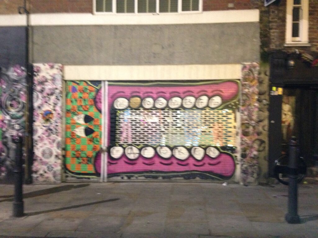 Sweet tooth teeth street art piece, Shoreditch, East London, 2013–2014, photographed by GraffitiStreet
