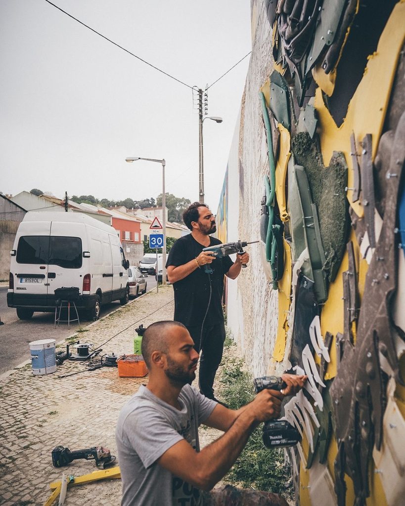 Origin mural by Bordalo II and Vhils exploring evolution and natural selection