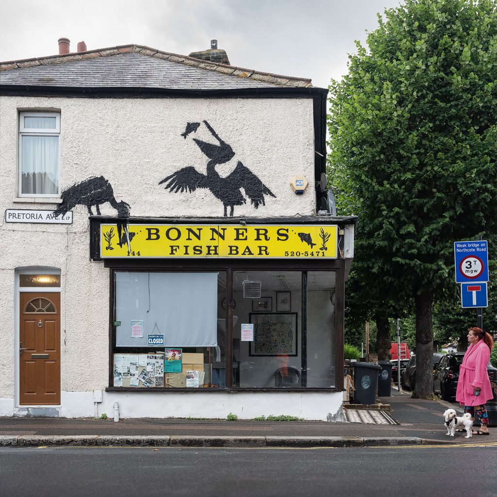 Pelican street art at Bonner’s Fish and Chip Shop during Banksy London Zoo 2024