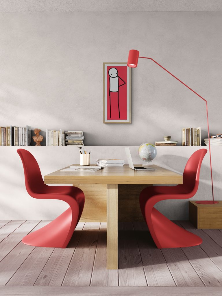 STIK Hip limited edition print displayed with modern Panton chairs