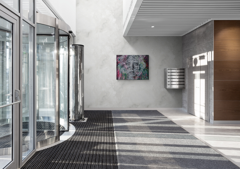 SNIK canvas displayed in contemporary hotel reception interior