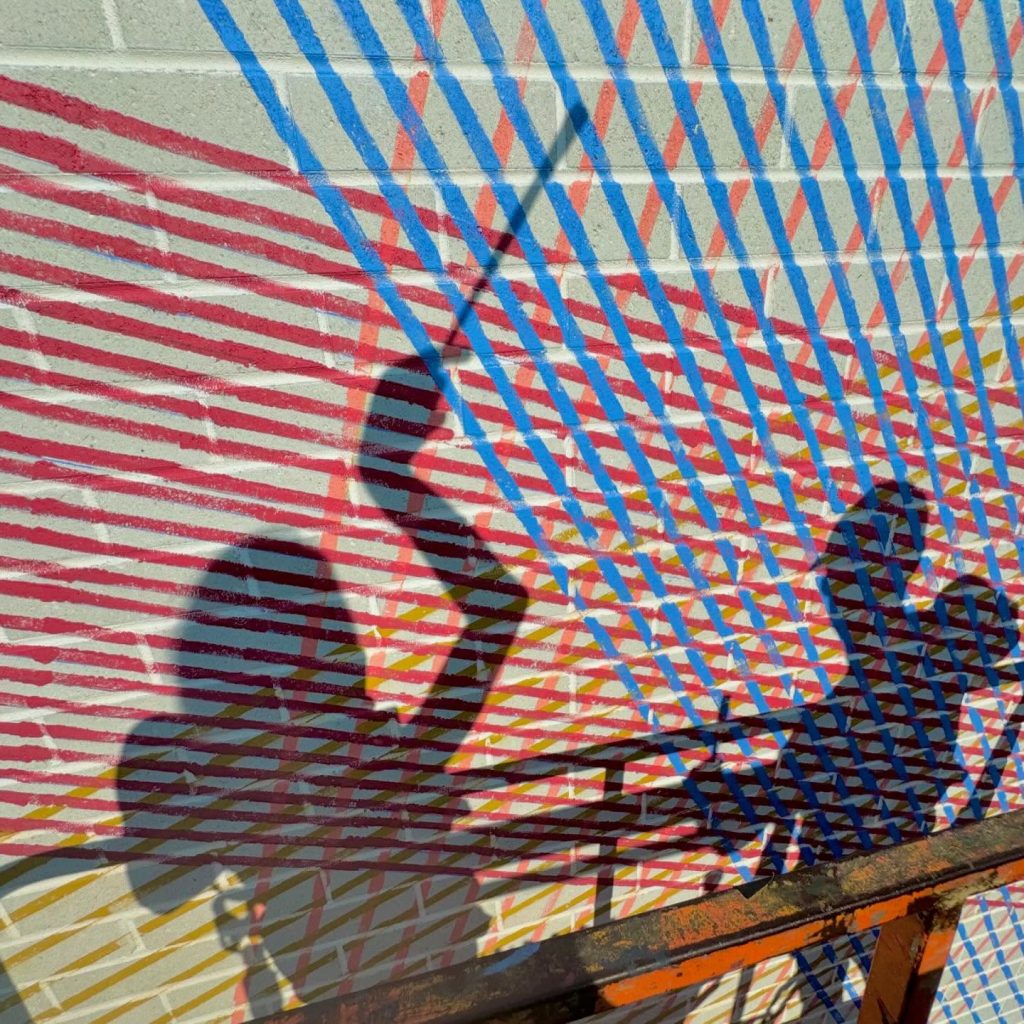 Geometric public mural Intertwined Perspectives by Cyndie Belhumeur