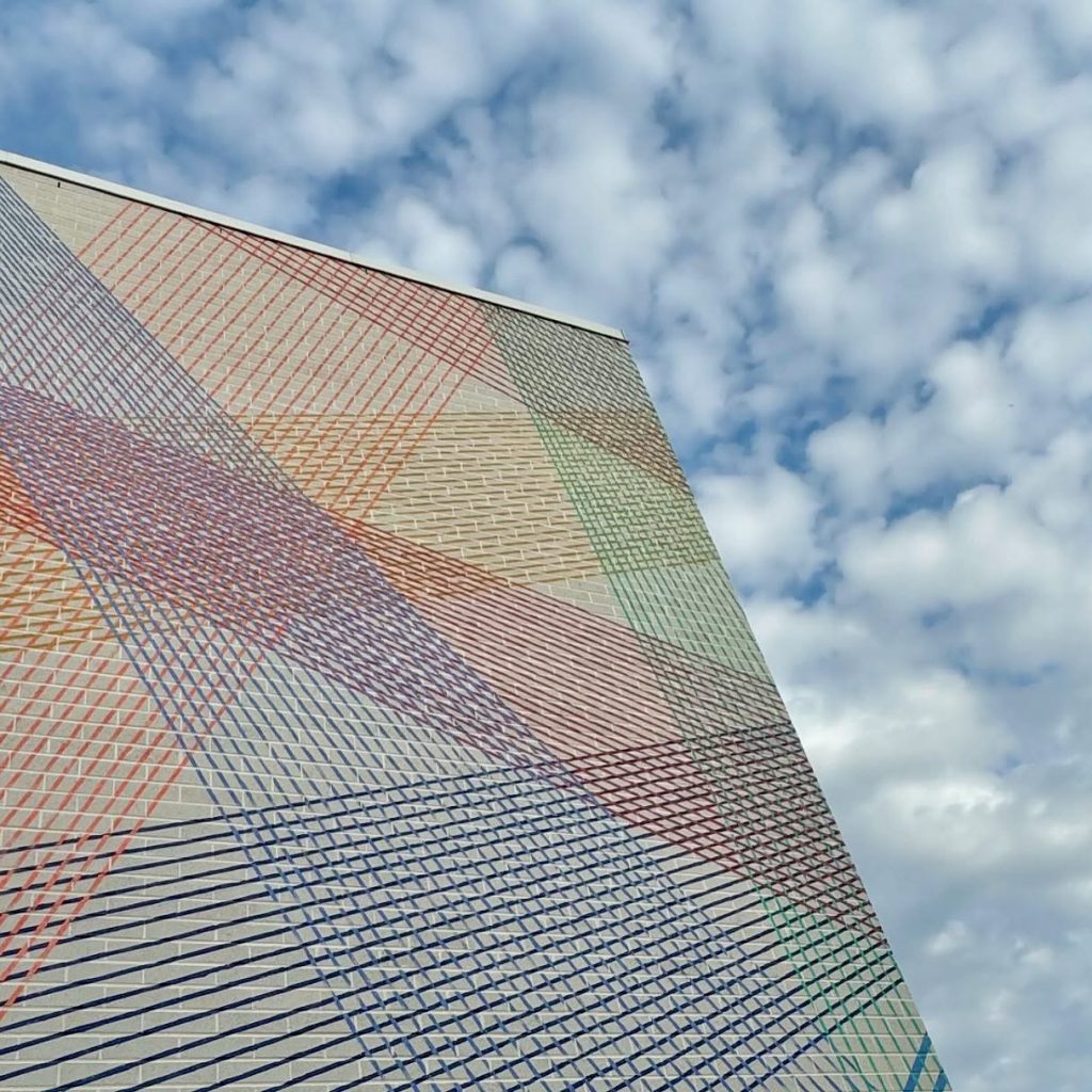 Detail of Cyndie Belhumeur Intertwined Perspectives mural with intersecting lines
