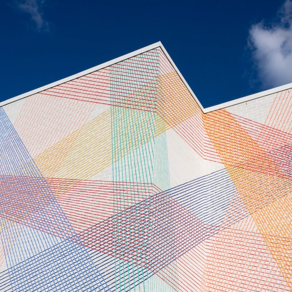 Detail of Cyndie Belhumeur Intertwined Perspectives mural with intersecting lines